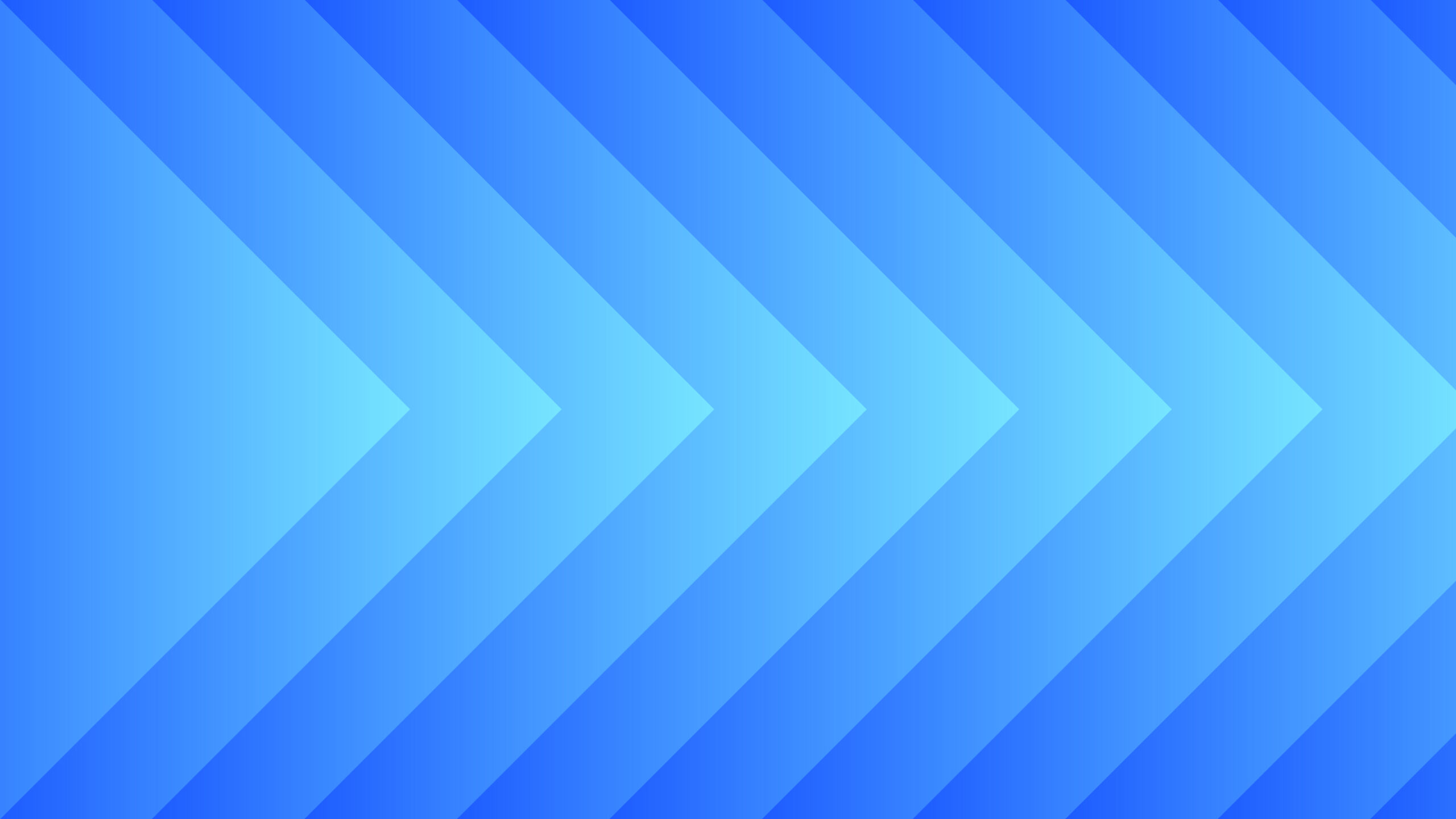 Abstract background with multiple blue chevrons pointing to the right, created with gradient shades of blue from light on the left to dark on the right.
